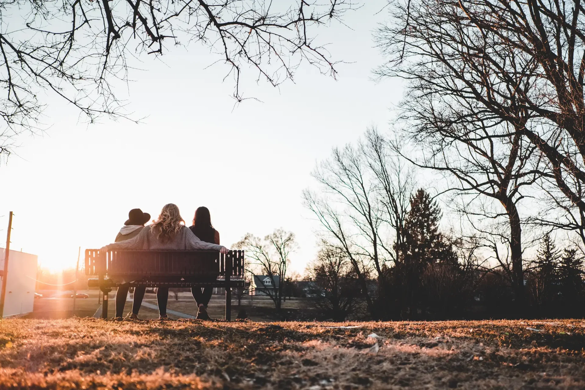 friends supporting eachother on bench